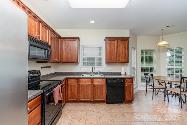 4874 Hawfield St, Kannapolis, NC 28083 - kitchen with black appliances, brown cabinets, and a sink