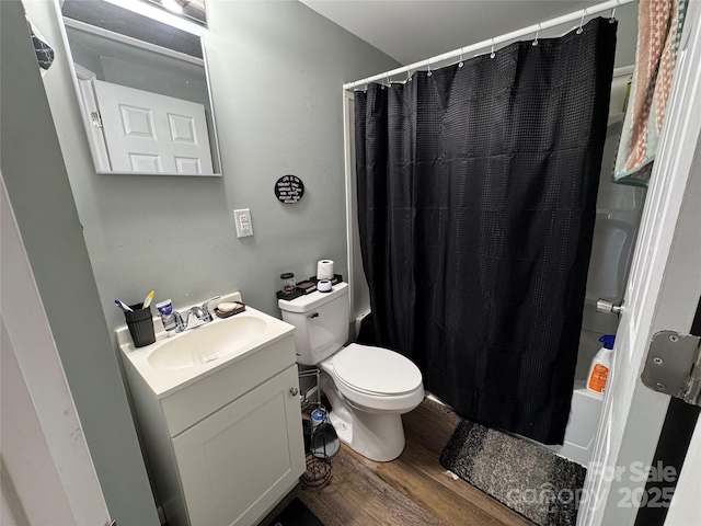 1010 Tennessee St, Kannapolis, NC 28083 - bathroom with wood finished floors, vanity, toilet, and shower / tub combo