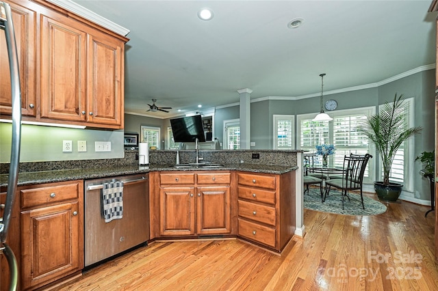11232 Tradition View Dr, Charlotte, NC 28269 - kitchen featuring dishwasher, brown cabinets, a ceiling fan, a peninsula, and a sink