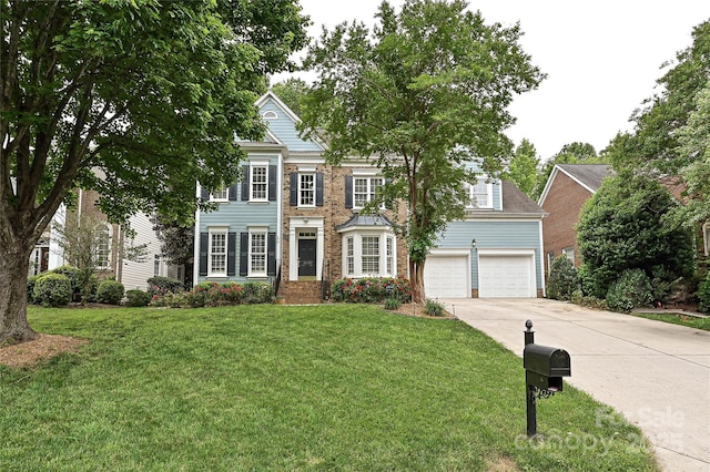 11232 Tradition View Dr, Charlotte, NC 28269 - view of front of property featuring concrete driveway, a garage, and a front yard