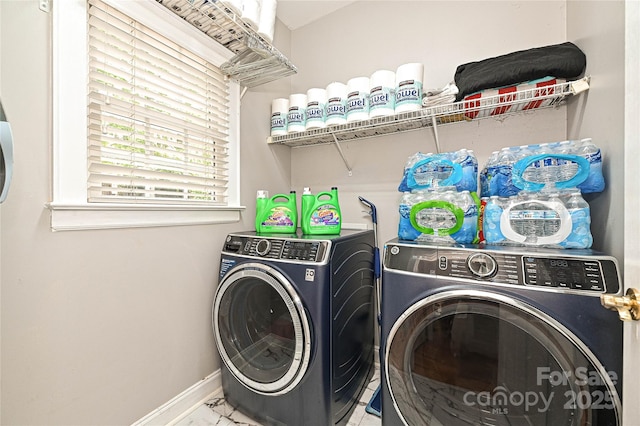 11232 Tradition View Dr, Charlotte, NC 28269 - laundry area featuring washer and dryer, baseboards, and marble finish flooring