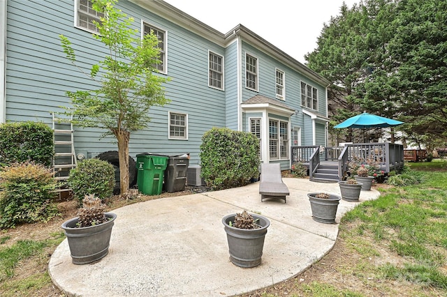 11232 Tradition View Dr, Charlotte, NC 28269 - rear view of house featuring a patio, a wooden deck, and central AC