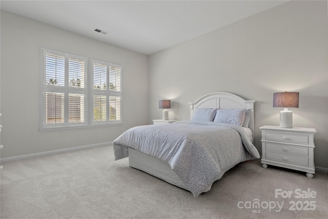 bedroom featuring light colored carpet, baseboards, and visible vents
