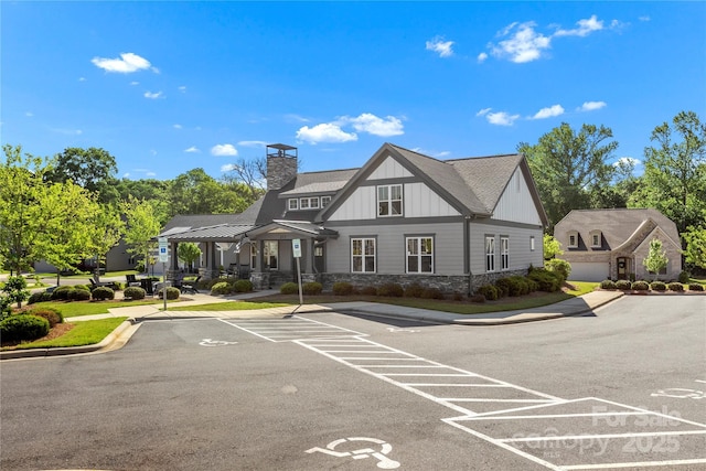 view of property featuring uncovered parking