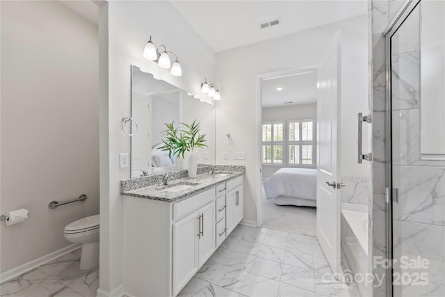 329 Brambling Ct, Wesley Chapel, NC 28110 - full bathroom with marble look tiles, baseboards, toilet, a marble finish shower, and double vanity