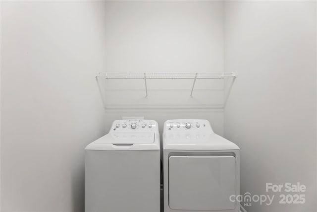 329 Brambling Ct, Wesley Chapel, NC 28110 - clothes washing area featuring washer and clothes dryer