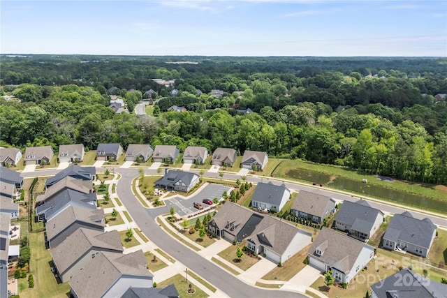 329 Brambling Ct, Wesley Chapel, NC 28110 - aerial view of residential area with a forest and a large body of water