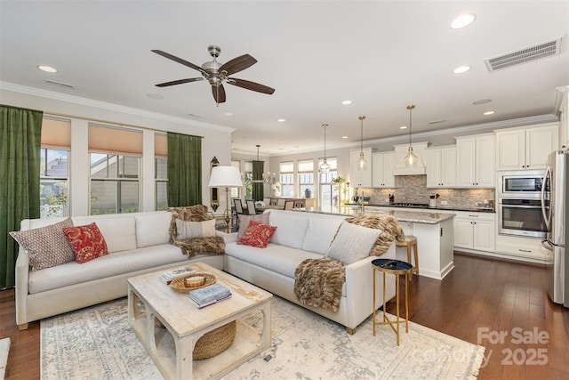 209 Helton Ln, Fort Mill, SC 29708 - living area with visible vents, crown molding, a ceiling fan, and dark wood finished floors