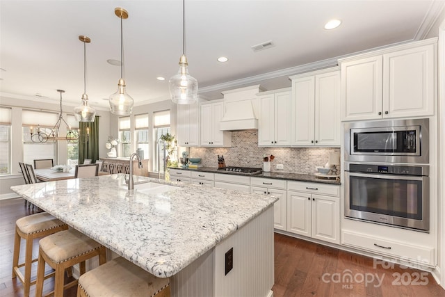 209 Helton Ln, Fort Mill, SC 29708 - kitchen with stainless steel appliances, custom range hood, ornamental molding, dark wood-style flooring, and a sink