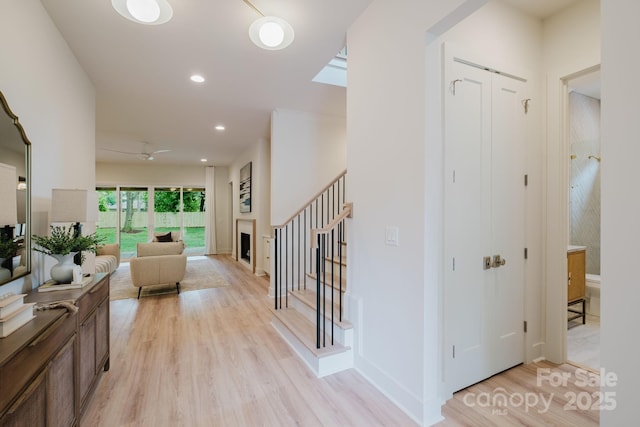 1807 Arnold Dr, Charlotte, NC 28205 - hallway with light wood-type flooring, stairway, recessed lighting, and baseboards