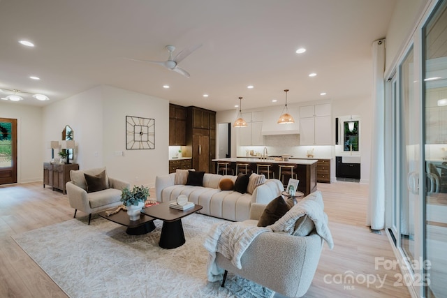 1807 Arnold Dr, Charlotte, NC 28205 - living room featuring light wood finished floors, recessed lighting, and ceiling fan