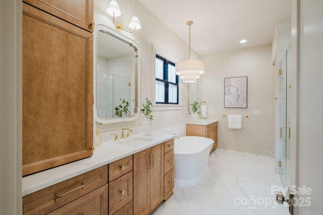1807 Arnold Dr, Charlotte, NC 28205 - bathroom featuring a stall shower, marble finish floors, a freestanding bath, two vanities, and recessed lighting