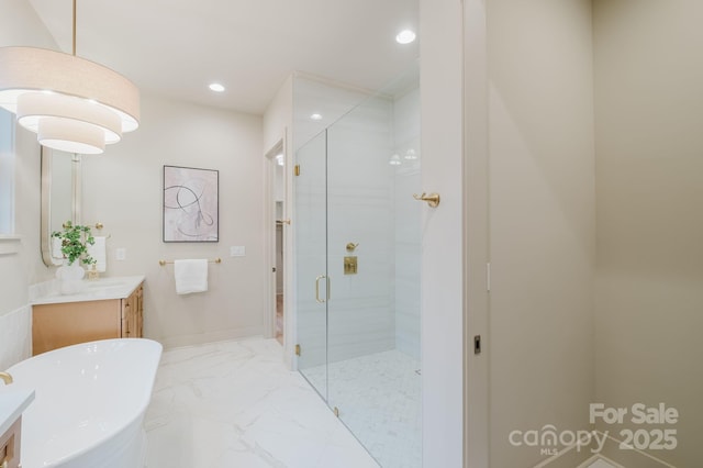 1807 Arnold Dr, Charlotte, NC 28205 - bathroom with a shower stall, marble finish flooring, vanity, a freestanding bath, and recessed lighting