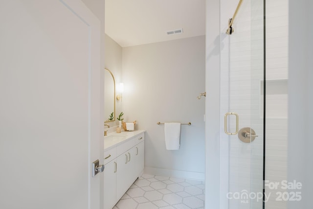 1807 Arnold Dr, Charlotte, NC 28205 - bathroom featuring a shower stall, vanity, and tile patterned flooring