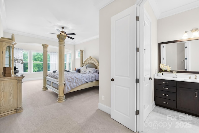 bedroom with crown molding, light carpet, and baseboards