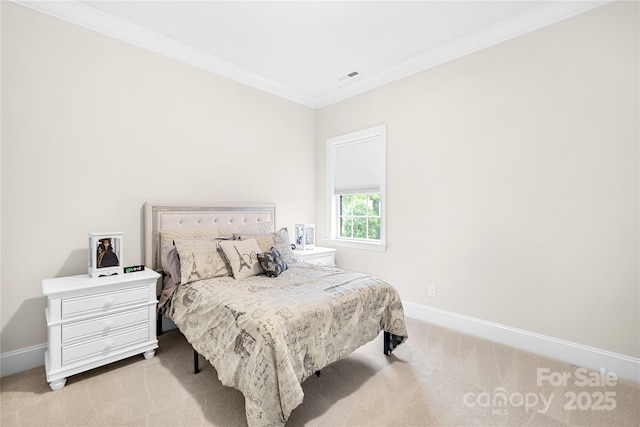 bedroom with ornamental molding, light carpet, and baseboards