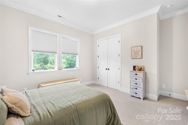 bedroom with baseboards, ornamental molding, visible vents, and light colored carpet
