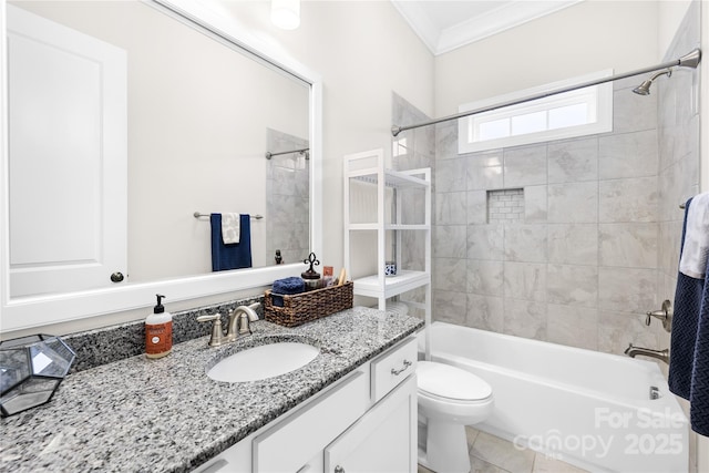 bathroom with toilet, tub / shower combination, tile patterned floors, crown molding, and vanity