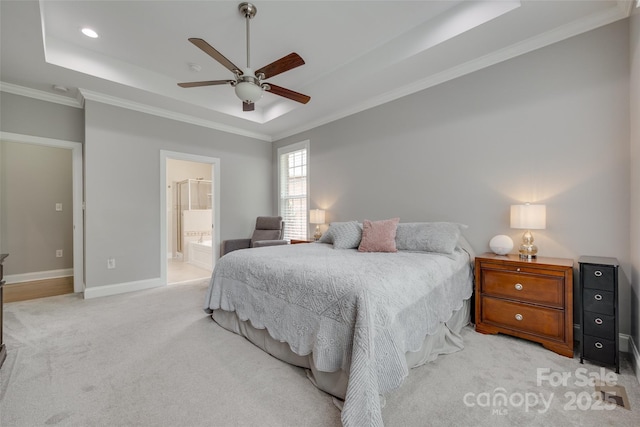 bedroom featuring baseboards, ornamental molding, a raised ceiling, and light carpet