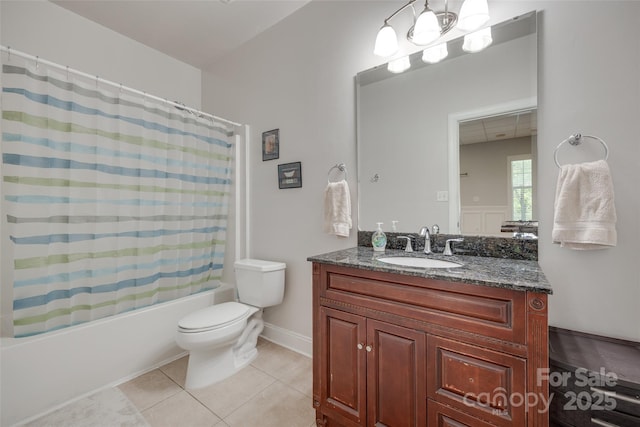 bathroom with vanity, toilet, tile patterned flooring, and shower / tub combo