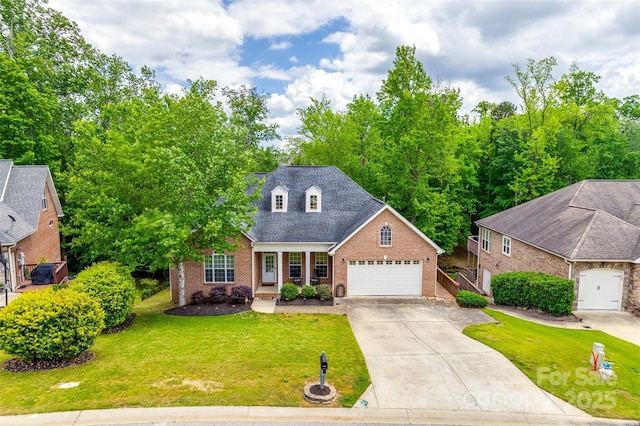 traditional-style home featuring covered porch, a garage, brick siding, a front lawn, and concrete driveway