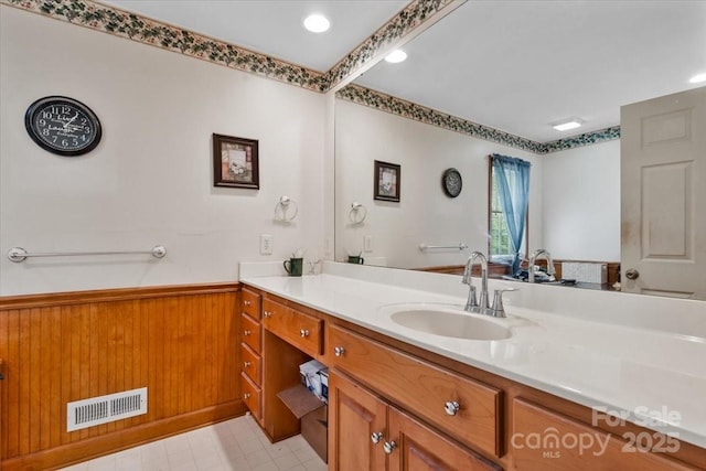 1044 Oakridge Farm Hwy, Mooresville, NC 28115 - bathroom with visible vents, vanity, and wainscoting