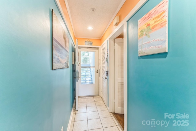 415 Ocean Creek Dr N Unit 2330, Myrtle Beach, SC 29572 - hallway with baseboards, light tile patterned floors, and a textured ceiling