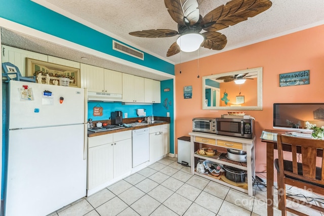 415 Ocean Creek Dr N Unit 2330, Myrtle Beach, SC 29572 - kitchen featuring appliances with stainless steel finishes, under cabinet range hood, a textured ceiling, ceiling fan, and white cabinetry