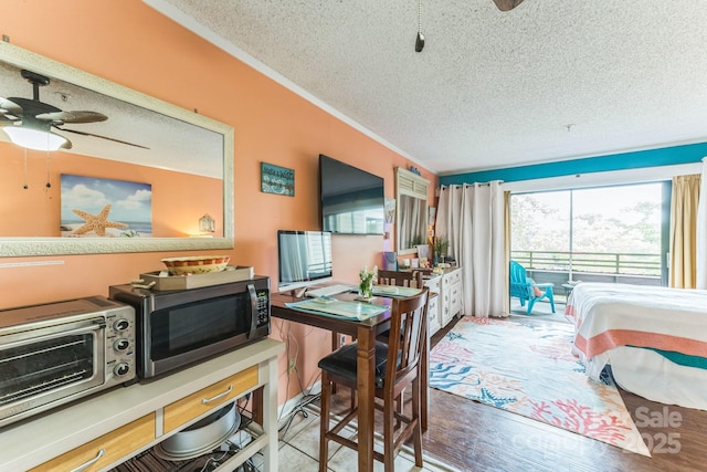 415 Ocean Creek Dr N Unit 2330, Myrtle Beach, SC 29572 - bedroom featuring a textured ceiling and access to outside