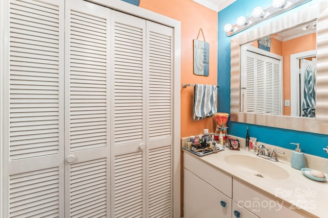 415 Ocean Creek Dr N Unit 2330, Myrtle Beach, SC 29572 - bathroom with a closet, ornamental molding, and vanity
