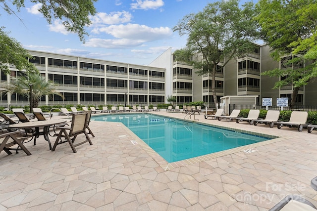 415 Ocean Creek Dr N Unit 2330, Myrtle Beach, SC 29572 - community pool with a patio area and fence