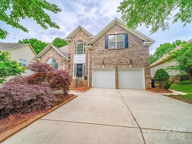 traditional home featuring concrete driveway, brick siding, and a garage