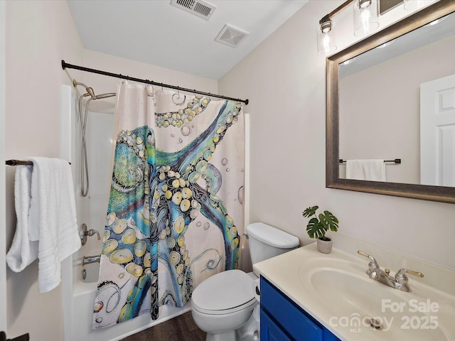 full bathroom featuring toilet, shower / bath combo, visible vents, and vanity