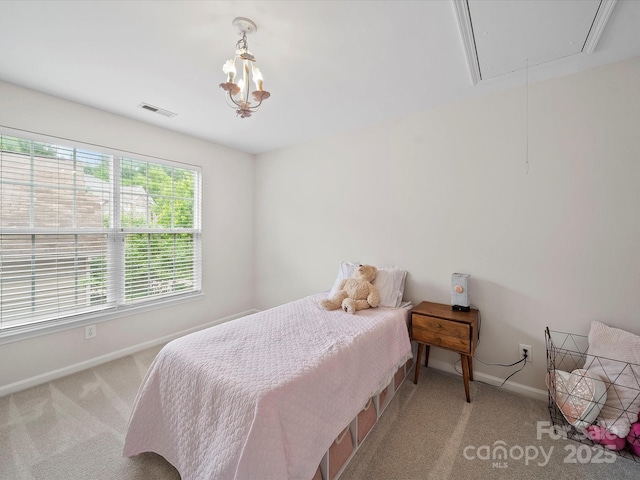 bedroom featuring attic access, carpet, visible vents, and baseboards