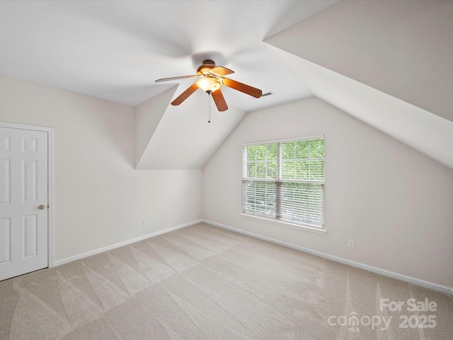 additional living space with ceiling fan, carpet floors, and baseboards