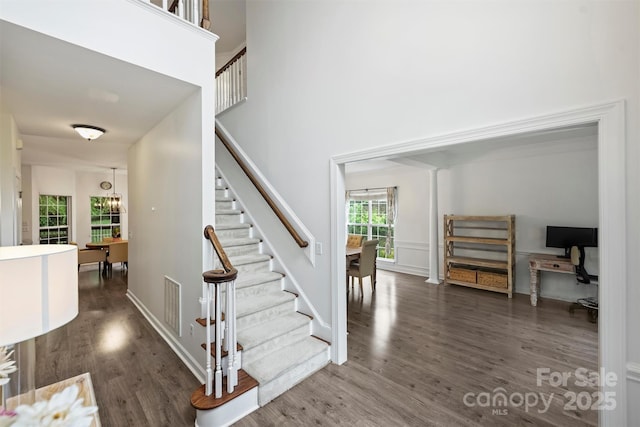 6723 Joliette Ln, Charlotte, NC 28277 - staircase featuring wood finished floors and a high ceiling