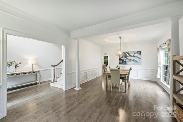 6723 Joliette Ln, Charlotte, NC 28277 - dining space featuring stairway, healthy amount of natural light, ornamental molding, decorative columns, and a decorative wall