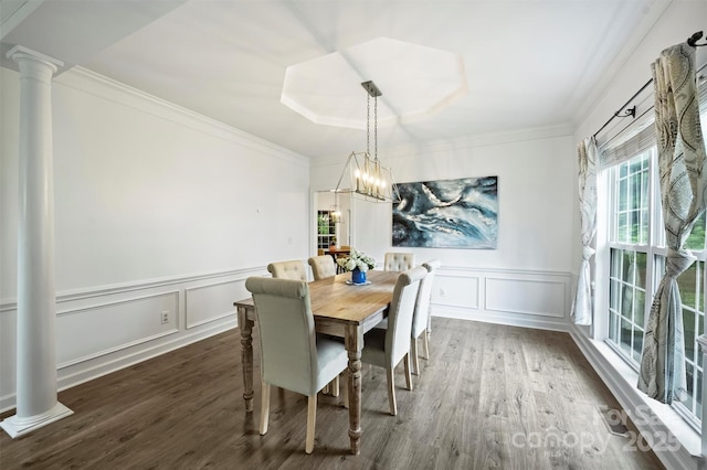 6723 Joliette Ln, Charlotte, NC 28277 - dining space featuring ornate columns, a decorative wall, wood finished floors, crown molding, and a wainscoted wall