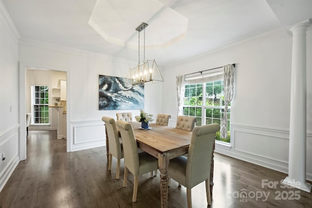 6723 Joliette Ln, Charlotte, NC 28277 - dining space with ornate columns, a decorative wall, a chandelier, ornamental molding, and dark wood-style floors