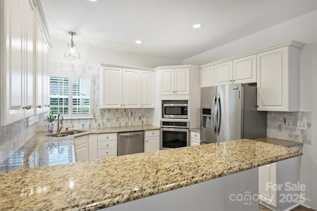 6723 Joliette Ln, Charlotte, NC 28277 - kitchen with stainless steel appliances, a sink, decorative backsplash, light stone countertops, and white cabinets