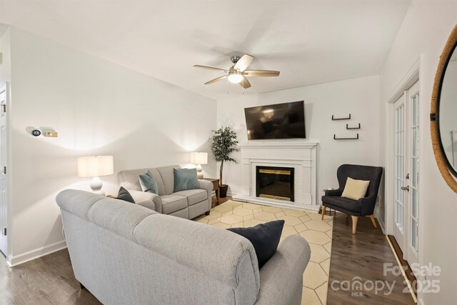 6723 Joliette Ln, Charlotte, NC 28277 - living area with a ceiling fan, wood finished floors, a glass covered fireplace, and baseboards