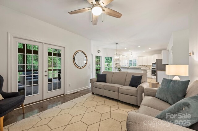 6723 Joliette Ln, Charlotte, NC 28277 - living area featuring light wood-style floors, plenty of natural light, ceiling fan, french doors, and recessed lighting