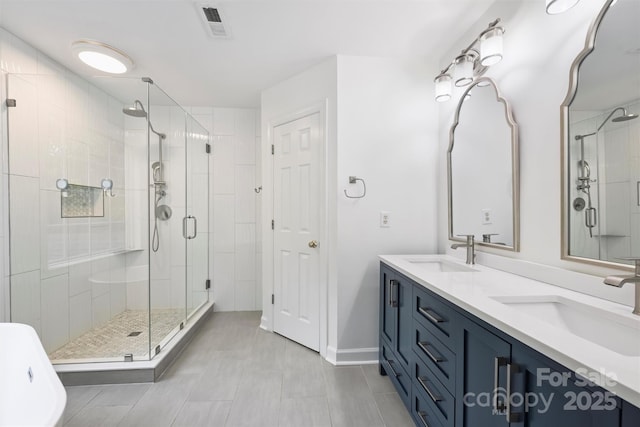 6723 Joliette Ln, Charlotte, NC 28277 - full bath with a shower stall, double vanity, and baseboards