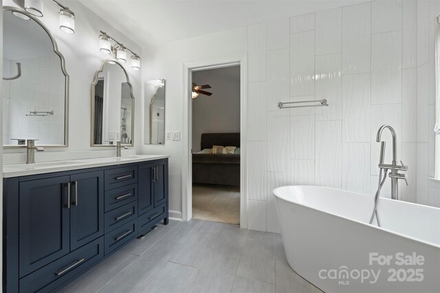 6723 Joliette Ln, Charlotte, NC 28277 - full bath with a ceiling fan, a soaking tub, double vanity, connected bathroom, and tile patterned floors