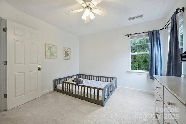 6723 Joliette Ln, Charlotte, NC 28277 - bedroom with light carpet, baseboards, a nursery area, and a ceiling fan