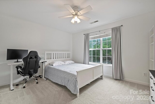 6723 Joliette Ln, Charlotte, NC 28277 - bedroom with light carpet, ceiling fan, an office area, and baseboards