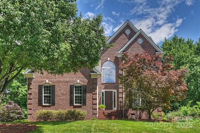 6723 Joliette Ln, Charlotte, NC 28277 - traditional home featuring a front yard and brick siding