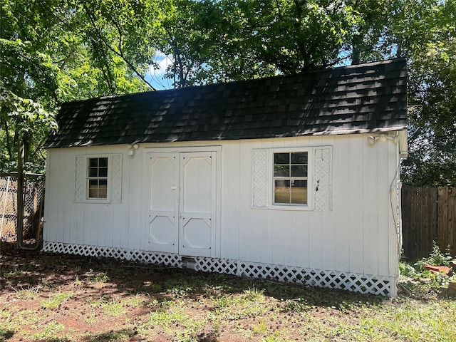view of shed with fence