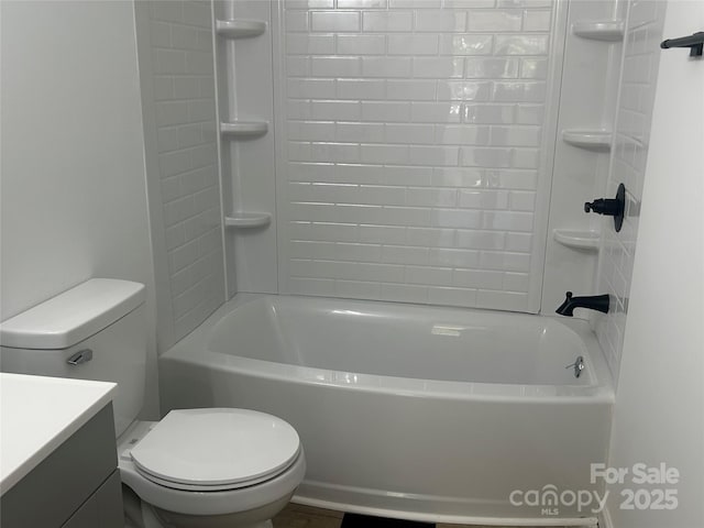 full bath with vanity, shower / bathing tub combination, and toilet