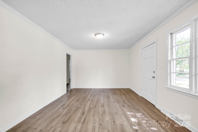 612 Summerow Rd Lot 22, Stanley, NC 28164 - interior space with light wood-style floors, baseboards, ornamental molding, and a textured ceiling